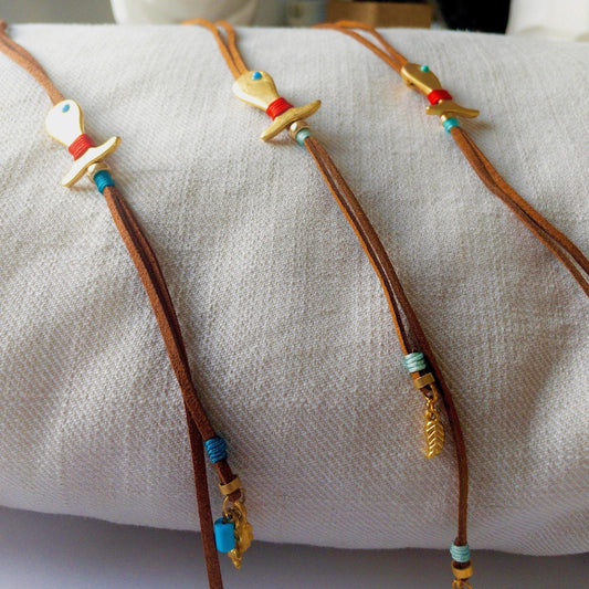 Long tassel leather necklace with a gold plated fishNecklacesBeachPerfect.de